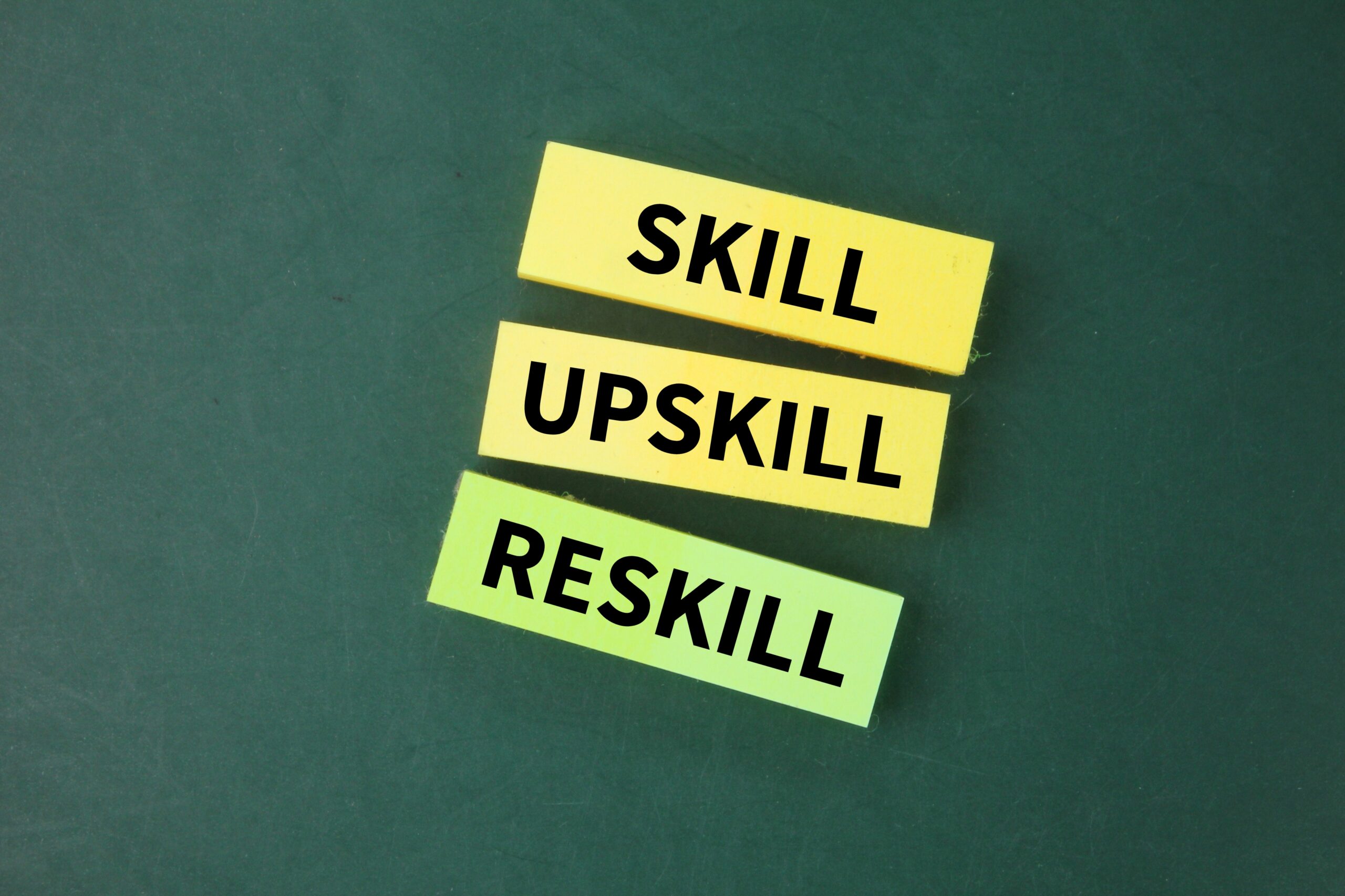 colored-paper-with-words-skill-updkill-reskill-skilling-upskilling-reskilling-skill