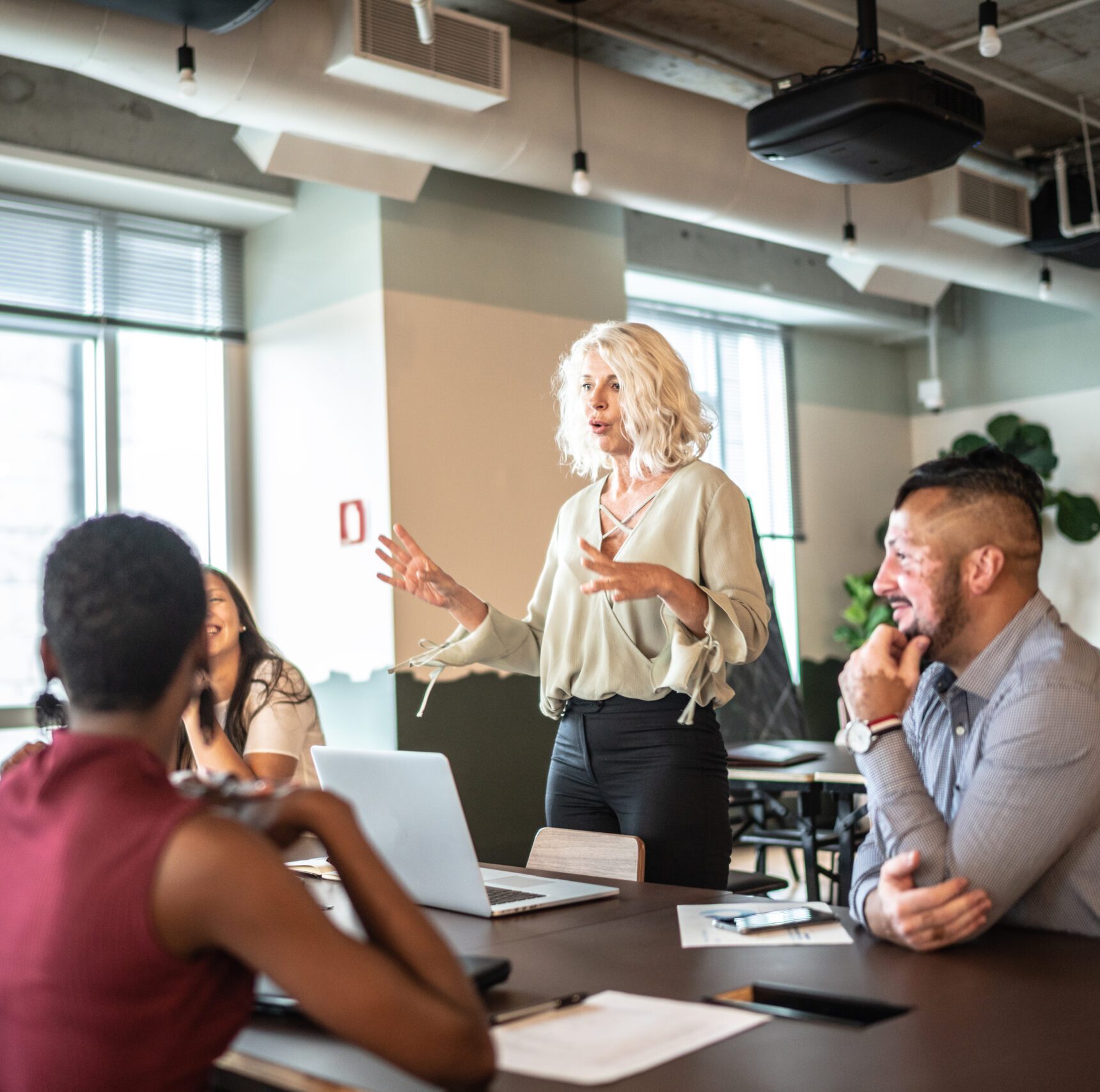 Leader businesswoman talking to his colleagues on presentation