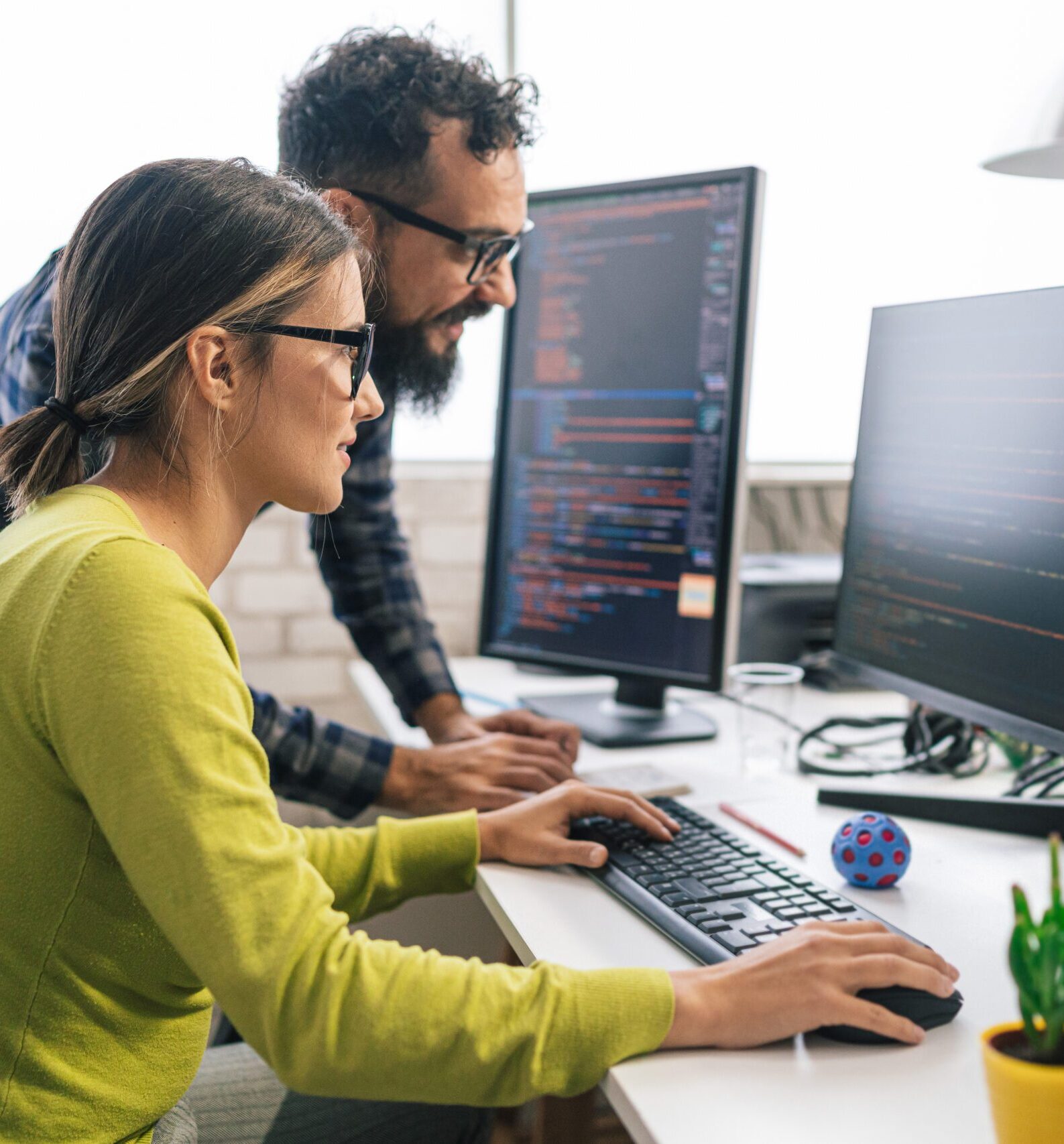 Software programmers analyzing html code and database, brainstorming script ideas to develop new security system. Engineers working with coding language collaborating on group project